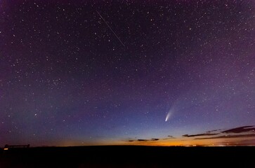 Breathtaking view of Neowise comet in blue starry sky from Great Falls, Montana