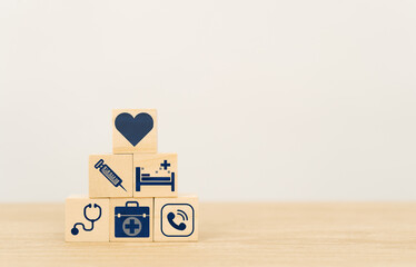 Health Insurance Concept,wood cube stacking with icon healthcare medical on wood background with...