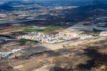 Aerial panoramic view on south part of Tenerife island, agricultural and volcatic landscape, Canary islands, Spain