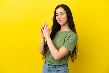 Young caucasian woman isolated on yellow background scheming something