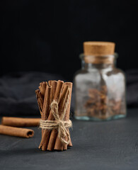 Bunch of dry cinnamon on black table, spice