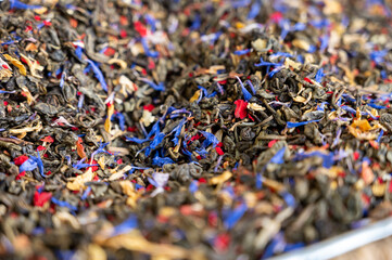 Blended black leaf dry tea with aromatic flowers, spices in tea shop in Andalusia, Spain