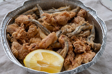 Spanish sea food, cripsy deep fried baby octopus, fish, calamari rings served with lemon
