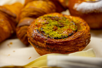 Austrian desserts, puff pastry on display in traditional bakery cafe in Vienna.
