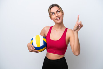 Young caucasian woman playing volleyball isolated on white background pointing up a great idea