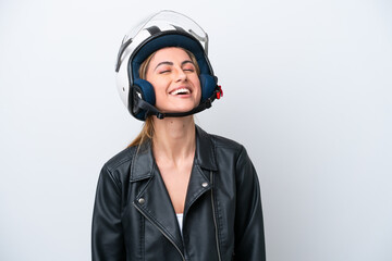 Young caucasian woman with a motorcycle helmet isolated on white background laughing