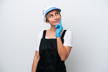 Fishwife woman isolated on white background thinking an idea while looking up
