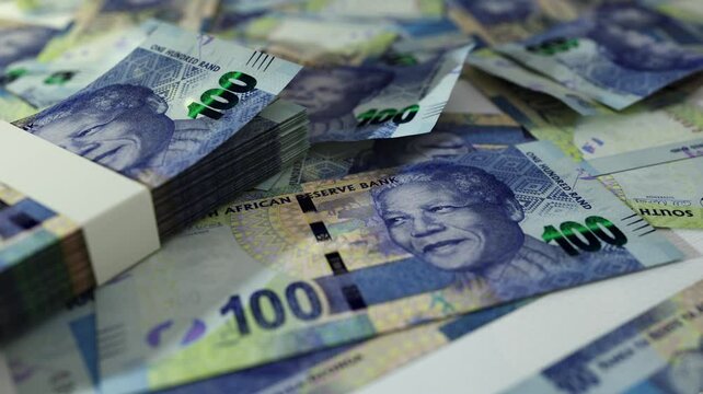 3D animation of Camera panning around spread South African Rand notes. Camera moving around Scattered Rand notes on surface