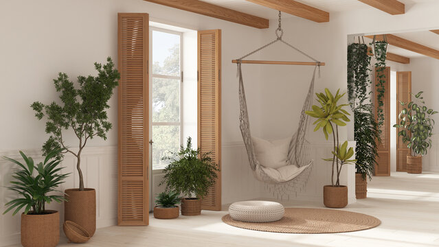 White living room in Boho style, rattan potted plants and lace hanging chair. Window with wooden shutters and parquet. Bohemian farmhouse interior design