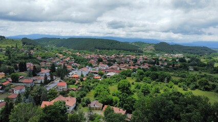 Aerial view of a village surrounded by mountains