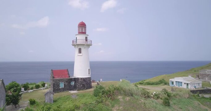Drone footage of the Basco Lighthouse on the shore in Batanes, Philippines