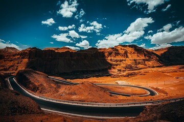 Beautiful shot of a curved road surrounded by cliffs