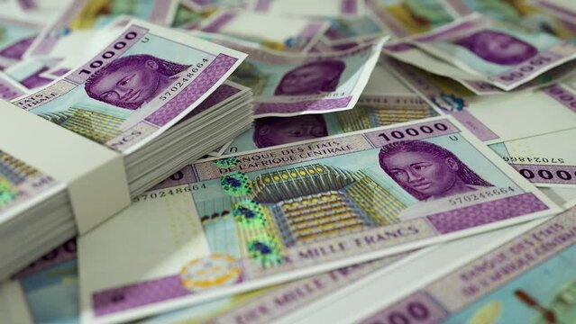 3D animation of Camera panning around spread Central African CFA franc notes. Camera moving around Scattered cfa notes on surface