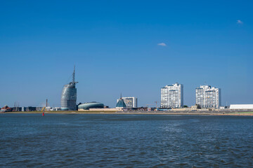 Fototapeta na wymiar View of the skyline of Bremerhaven/Germany seen from the river Weser