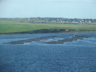 Fish farm in front of Orkney Mainland, Orkney Islands, Scotland, United Kingdom