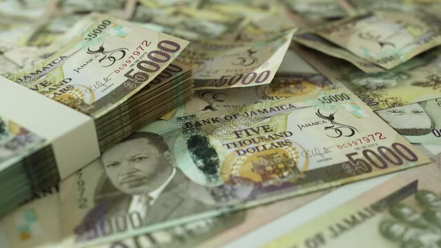 3D animation of Camera panning around spread Jamaican dollar notes. Camera moving around Scattered dollar notes on surface