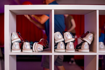 Rental bowling shoes on location with people bowling in the background 
