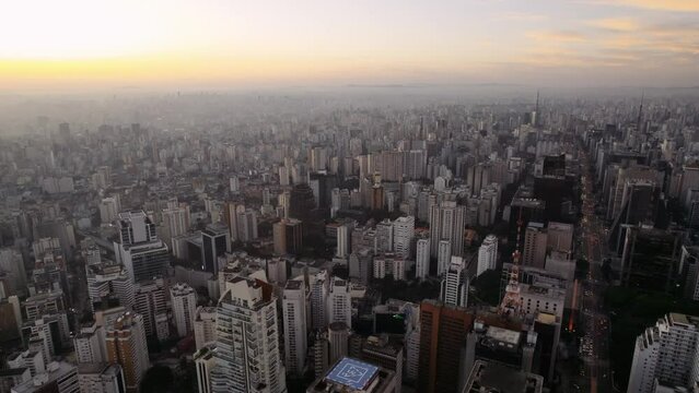 Aerial view of the city of Sao Paulo, Brazil at sunset. Cinematic 4K