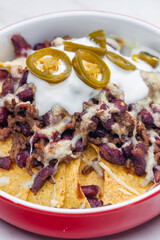 nachos baked with mince beef meat, cheese and red beans