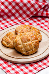 cracklings buns on wooden board