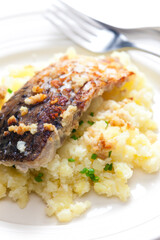 grilled carp with garlic served with mashed potatoes