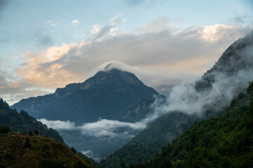 Beautiful  mountains landscape on the sunset. High mountains and hills in the fog. Svaneti, Georgia