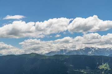 Fototapeta premium Beautiful mountain landscape. High snow covered mountains in the fog .