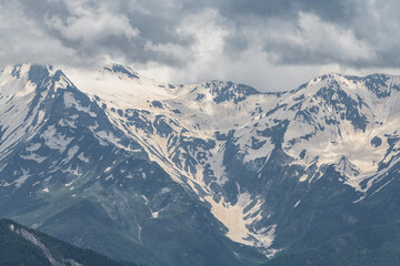 Fototapeta premium Beautiful mountain landscape. High snow covered mountains in the fog .