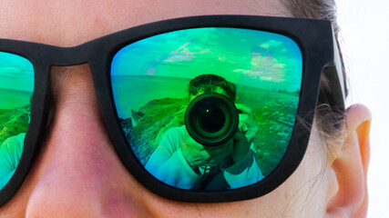 Rybakovka, Odessa region / Ukraine - 03/05/2021 : Reflection in a girl's sunglasses.