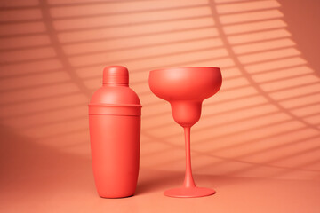 Cocktail glass and shaker on a pink background. - Summer concept