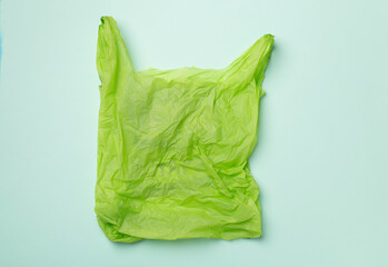 Disposable plastic bag on color background, top view