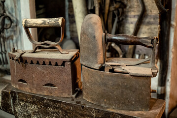 Rusty vintage press irons close up