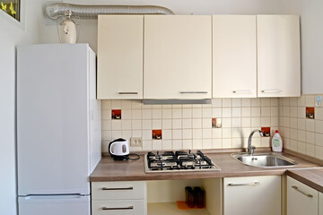 A fragment of the interior of the kitchen in light colors