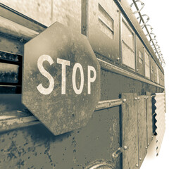 close up on stop sign of the zombie bus in white background © DM7