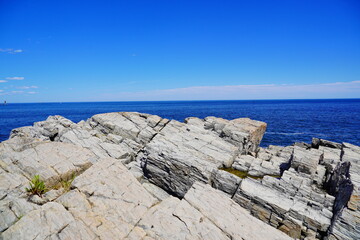 Atlantic ocean waves and Rocks along coastline in Portland, Maine, USA