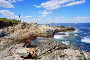 Fototapeta na wymiar Atlantic ocean waves and Rocks along coastline in Portland, Maine, USA