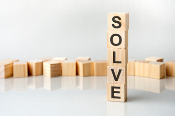 solve concept. wooden blocks with text on grey table. copy space