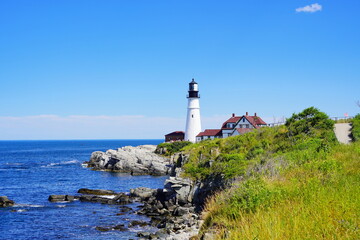 Fototapeta na wymiar Atlantic ocean waves and rock beach along coastline in Portland, Maine, USA