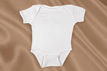 Onesie Mockup on Elegant Golden Fabric