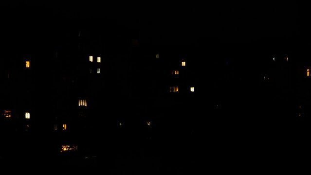 Glow In The Dark Windows Of A Large Apartment Building That Periodically Turn On And Off Until Everything Goes Dark