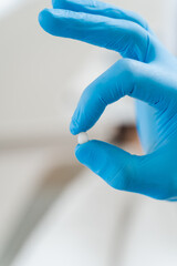 Close-up dental veneer teeth implant. Dentistry. Consultation with dentist about tooth implantation...