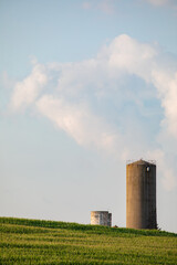 Fototapeta na wymiar Large silo in a corn field on a late summer day in Amish country, Ohio