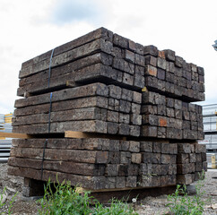 Large stack of railroad ties in a lumber yard