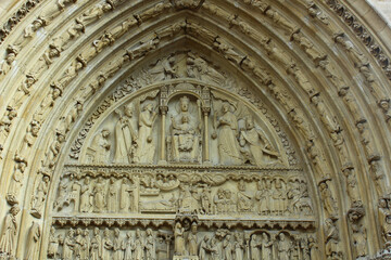 Sculptural art above the entrance to Notre Dame Cathedral Paris, France	
