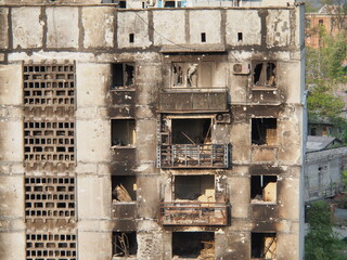War in Ukraine. The ruins of residential buildings burned down and destroyed by Russian troops in Mariupol.