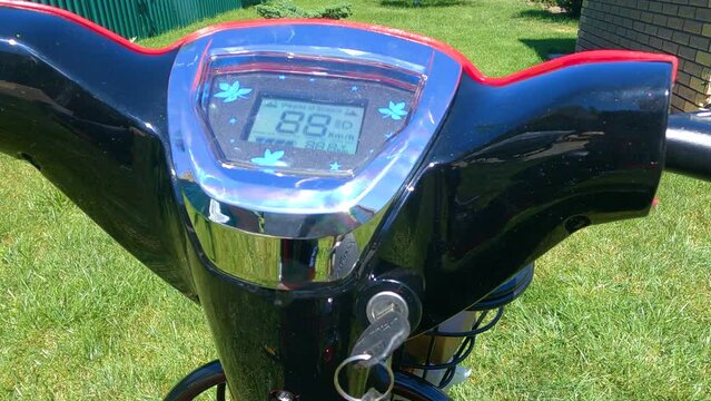 Moment of turning on the ignition on the electric bike.