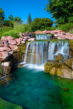 Long exposure photography of flowing water and waterfall at the public park  arboretum in East Sioux Falls Historic Site, South Dakota
