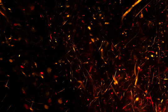 Fire Sparkles In Dark Blue Bokeh Background