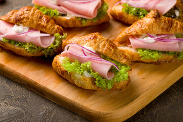 mini croissant with ham and cheese and red onion, canapes