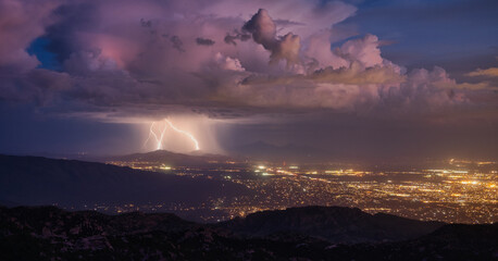 Lightning storm over Tucson, Arizona during monsoon season.  - obrazy, fototapety, plakaty